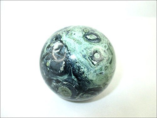 Jet International Kambaba Jasper sphere in night shot shows natural luster.