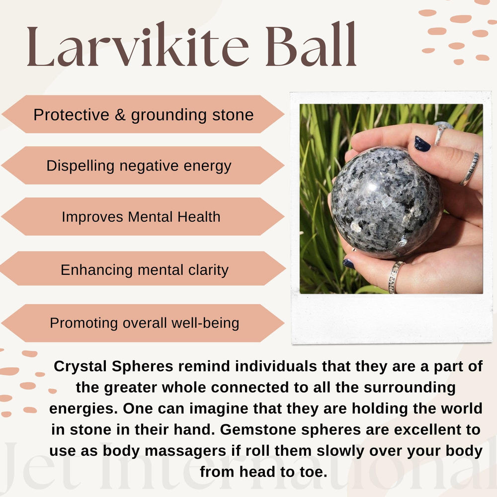 Jet International Larvikite ball on altar aids crystal grids.