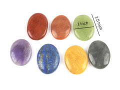 Jet International polished oval stones arranged for chakra alignment and Reiki sessions.