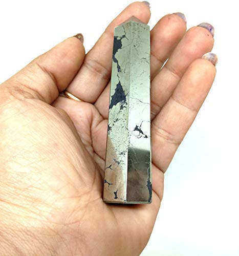 Jet International Pyrite Obelisk, meditation setup, enhances serene energy.