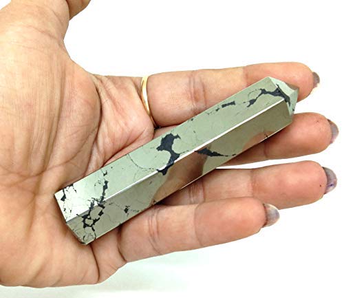 Jet International Pyrite Obelisk, close-up sheen, metallic glow for ambience.
