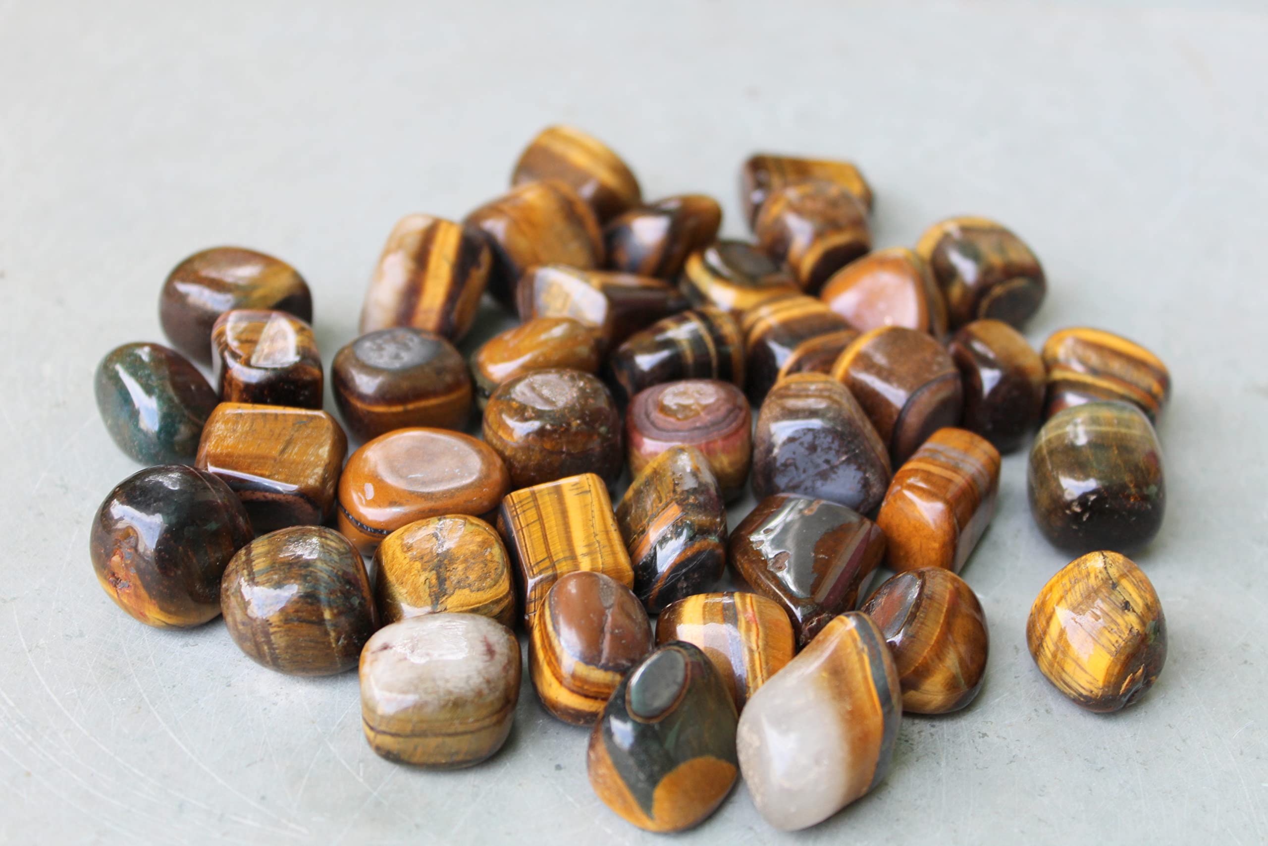 Jet International Tiger Eye Stones on a shelf display for balanced ambience.