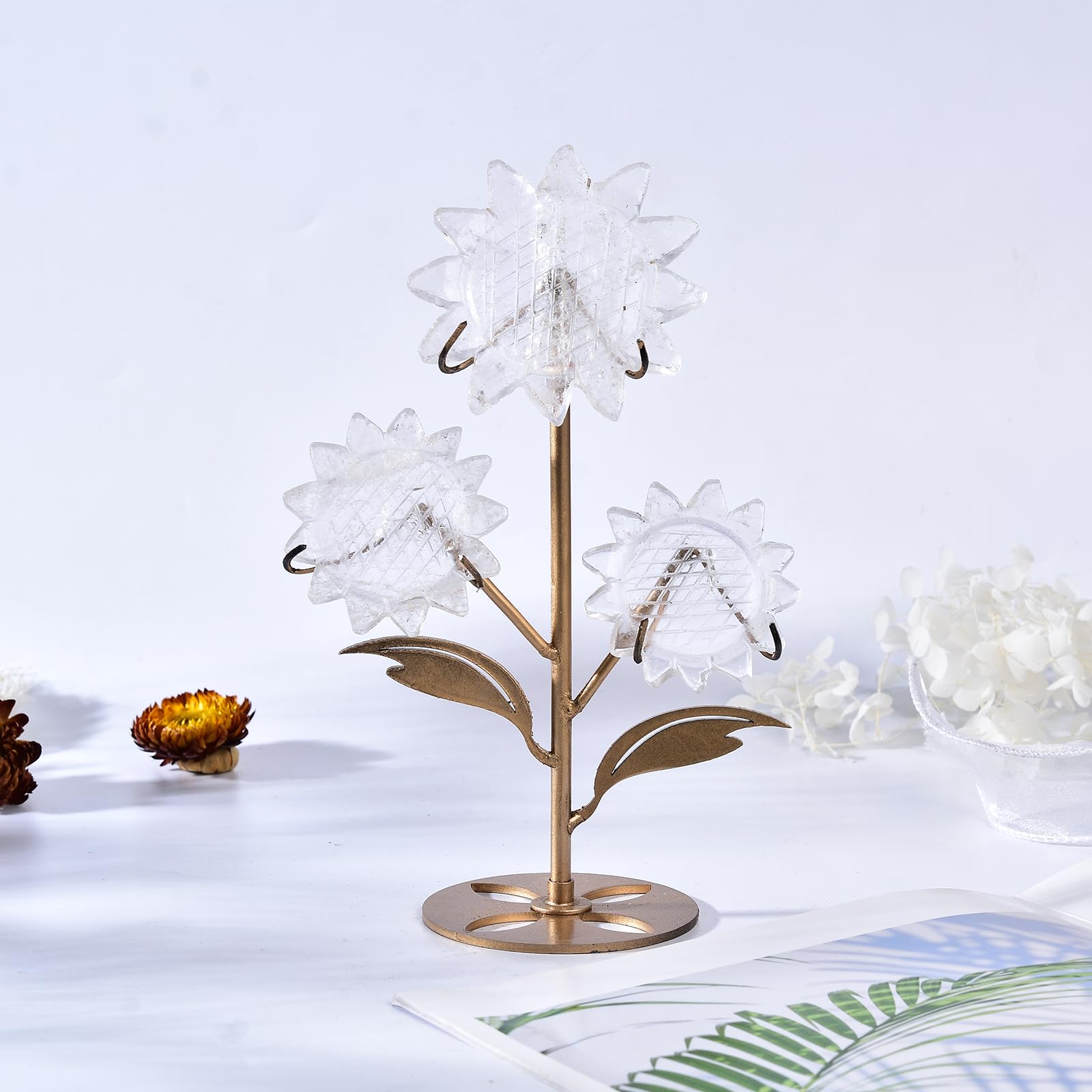JIC Gem Clear Quartz Sunflower centerpiece on a shelf adds warm ambient light.