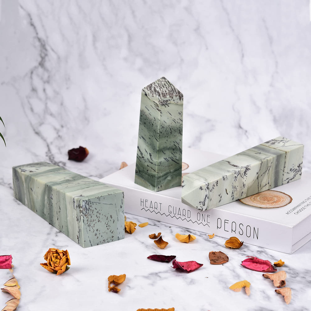 JIC Gem dendritic sage-green jasper wand on desk invites opportunities.