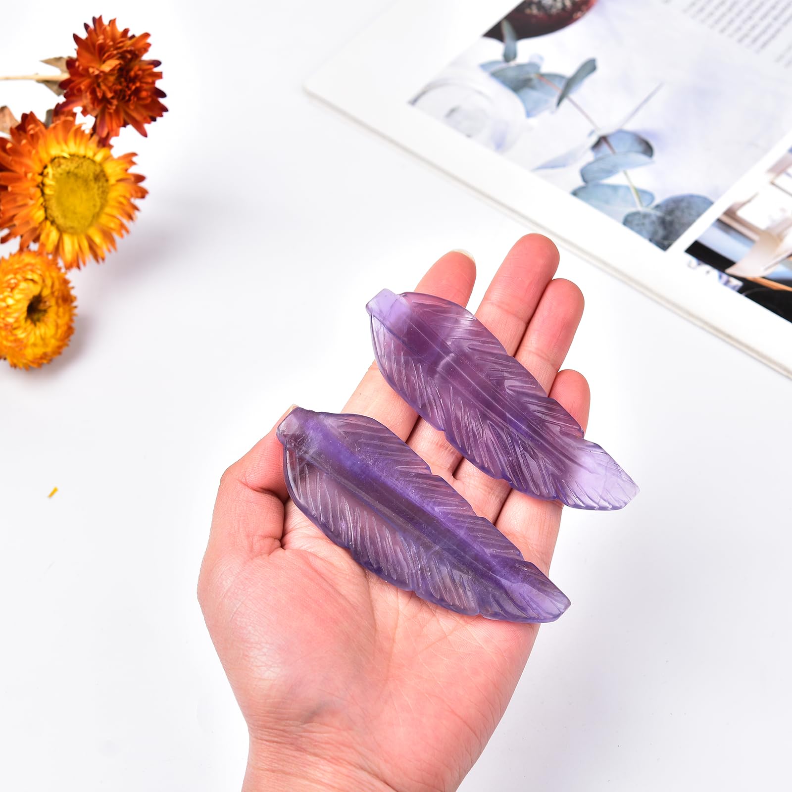 JIC Gem feather-shaped fluorite ornament on desk enhances decor and focus