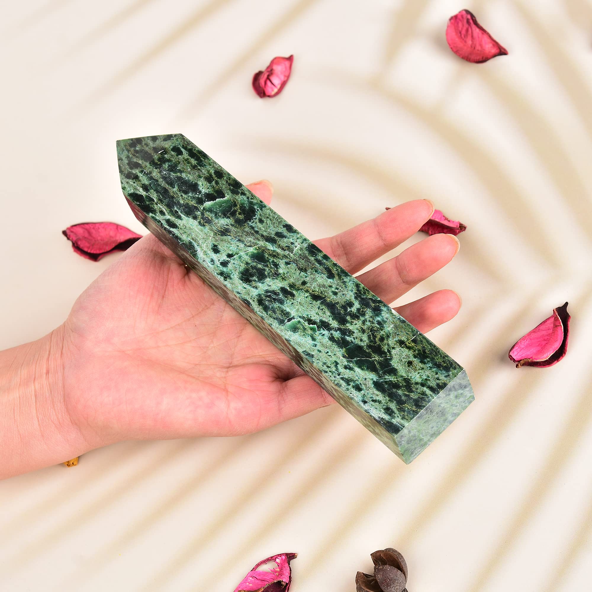 JIC Gem close-up of green emerald quartz crystal tower highlighting vibrant hues.