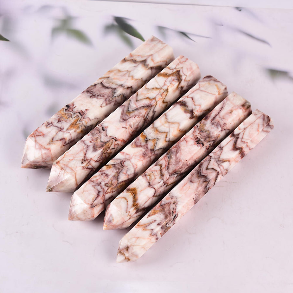 JIC Gem large quartz crystal wand tower emphasizing size and natural color variation.