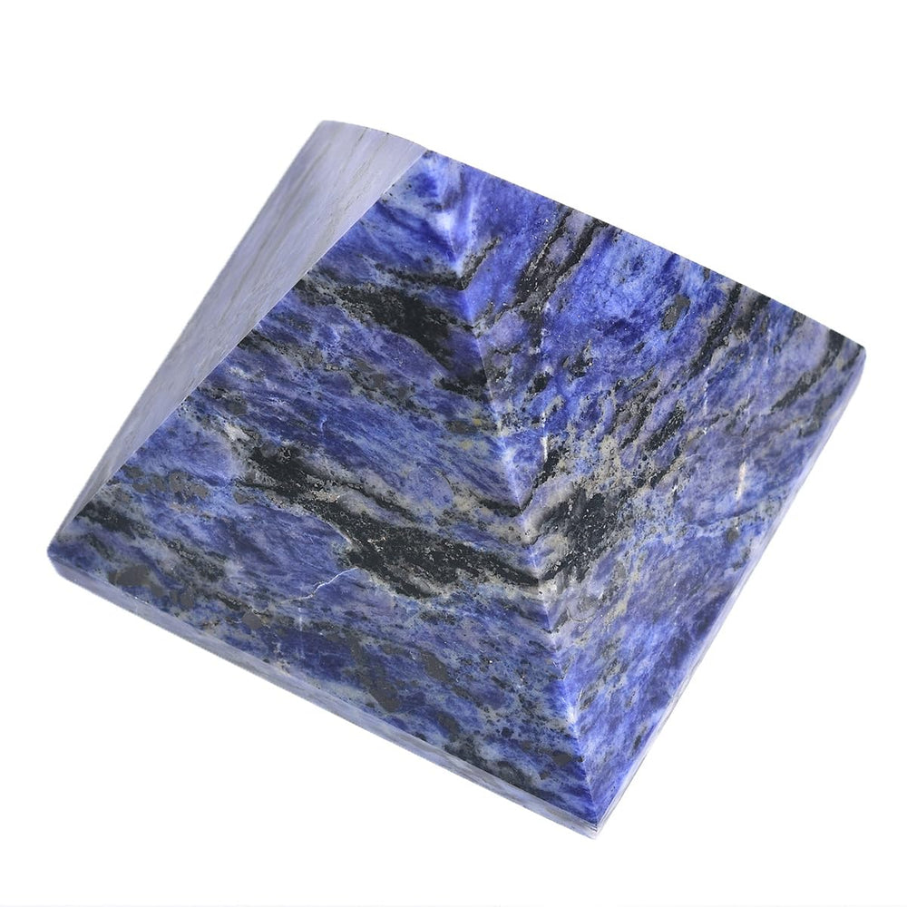JIC Gem sodalite pyramid on desk creating a focused workspace vibe