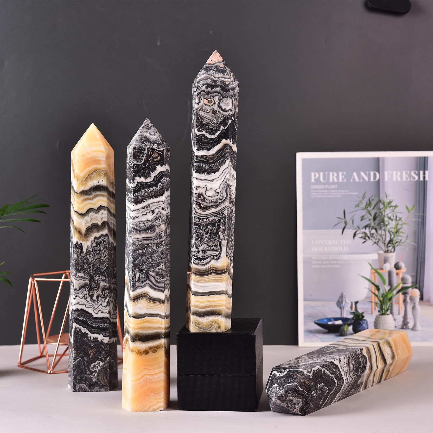JIC Gem natural calcite wand highlighting unique variations for ambiance.