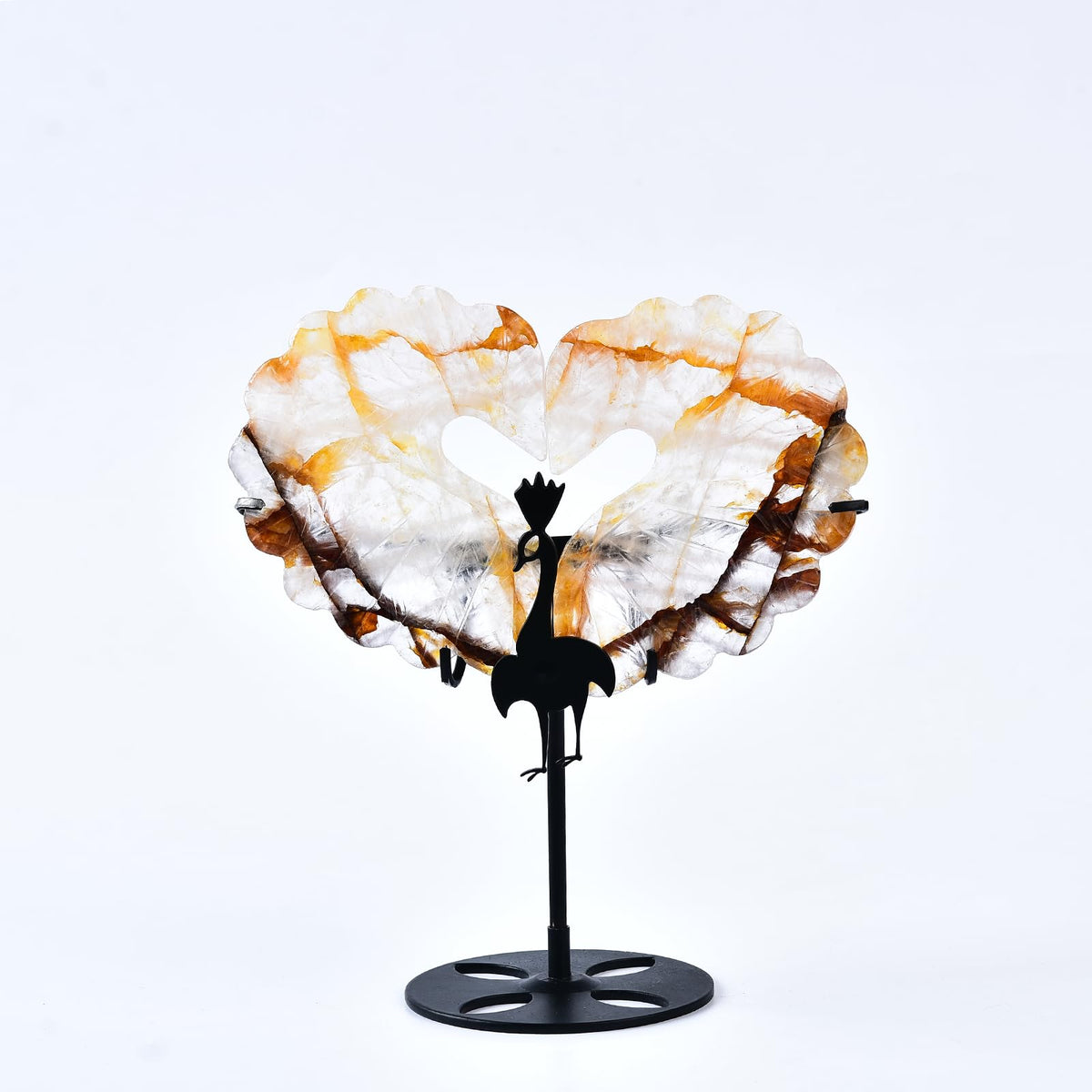 JIC Gem orange hematoid quartz heart with wings on stand for elegant desk decor.