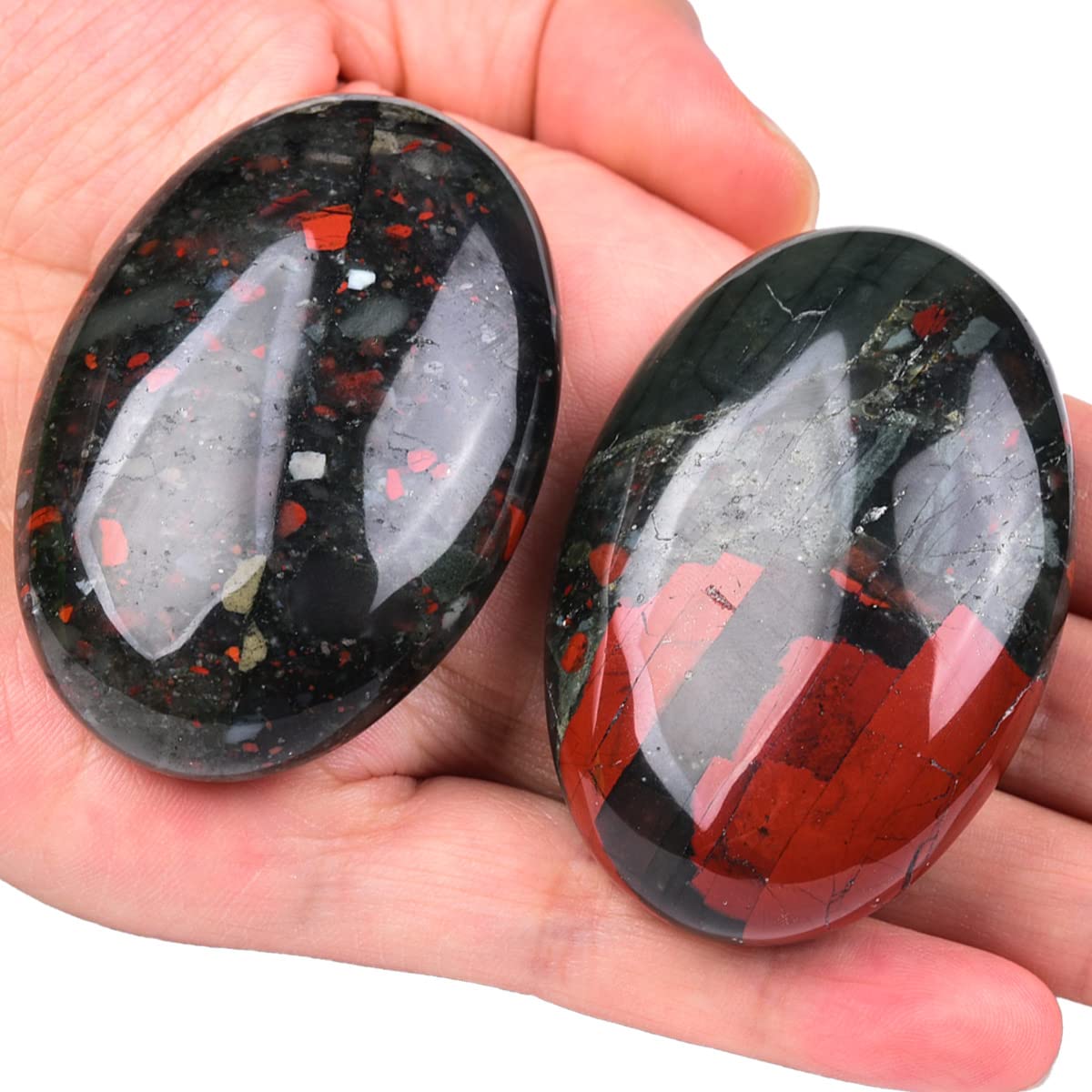 Polished Africa Bloodstone palm stone with natural color variations by JIC Gem.