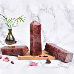 JIC Gem red quartz tower on shelf display catching light for ambiance