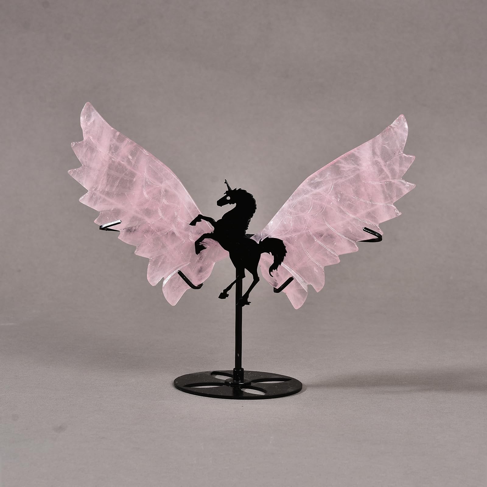 JIC Gem rose quartz unicorn wings on stand for serene decor.