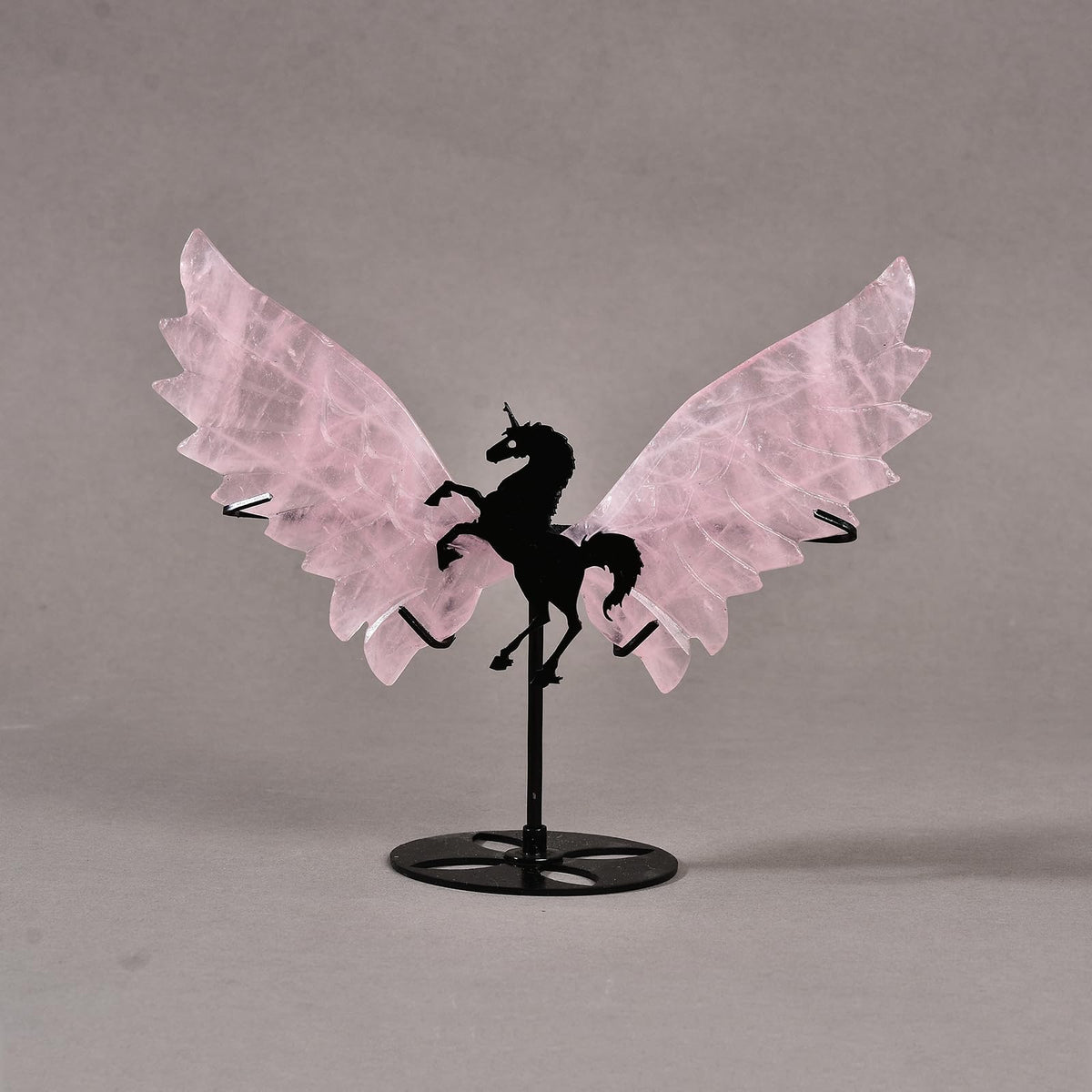 JIC Gem rose quartz unicorn wings on stand for serene decor.