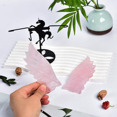 JIC Gem rose quartz unicorn wings displayed as a focal decor piece.
