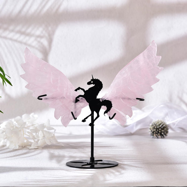 JIC Gem rose quartz wings pair with crystals for harmony in a shelf setup.