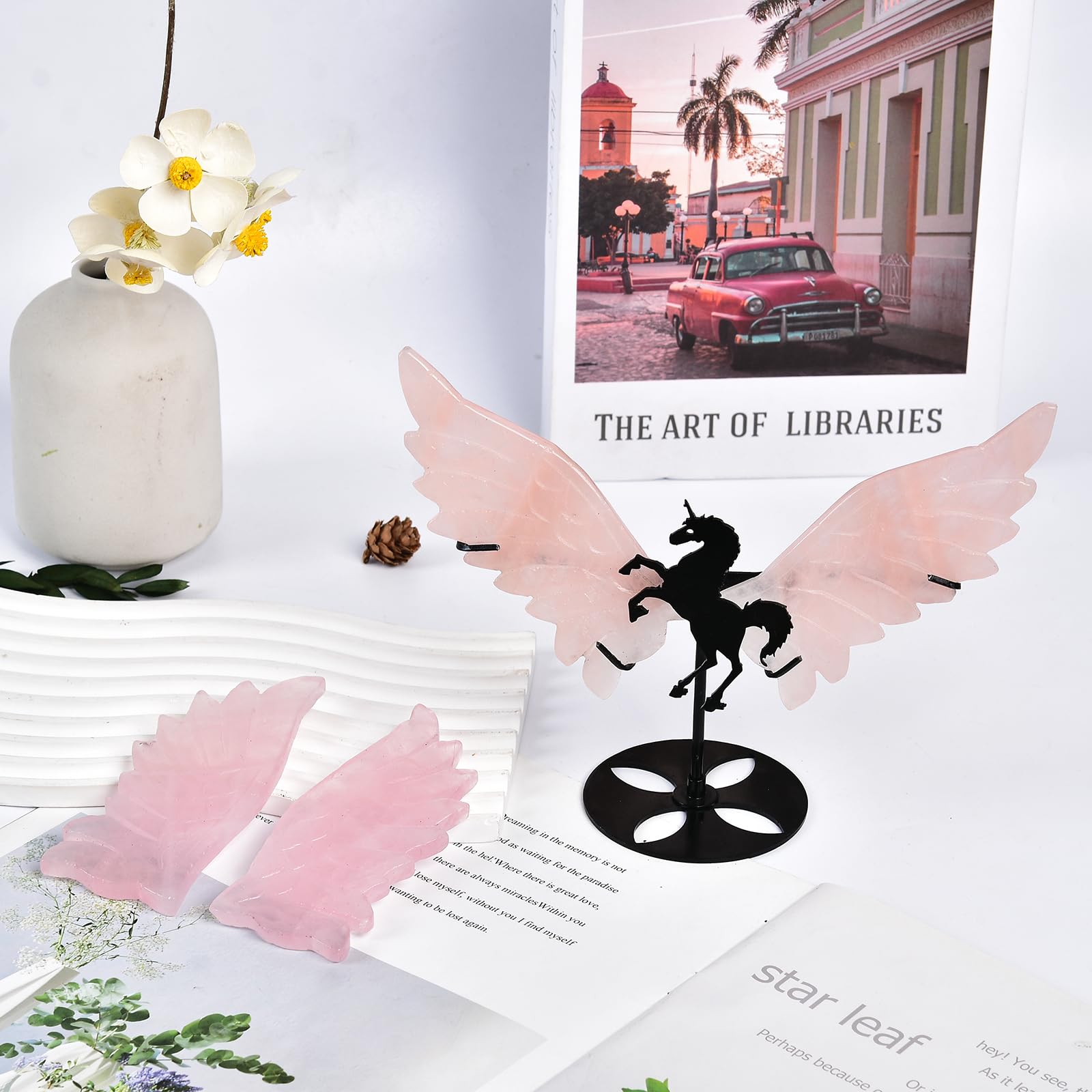 JIC Gem rose quartz wings provide calming room accents on a stand.