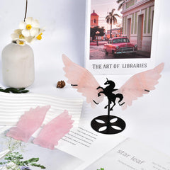 JIC Gem rose quartz wings provide calming room accents on a stand.
