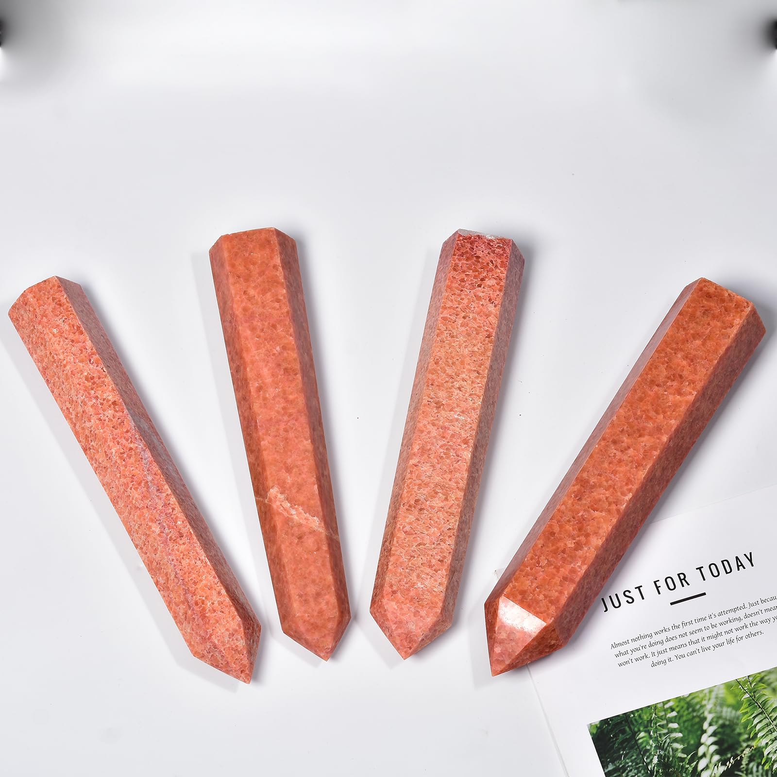 JIC Gem sunstone obelisk on desk enhances decor and invites positive ambience.
