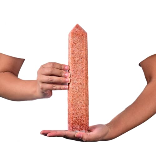 JIC Gem sunstone obelisk in hand demonstrates portable size for meditation.