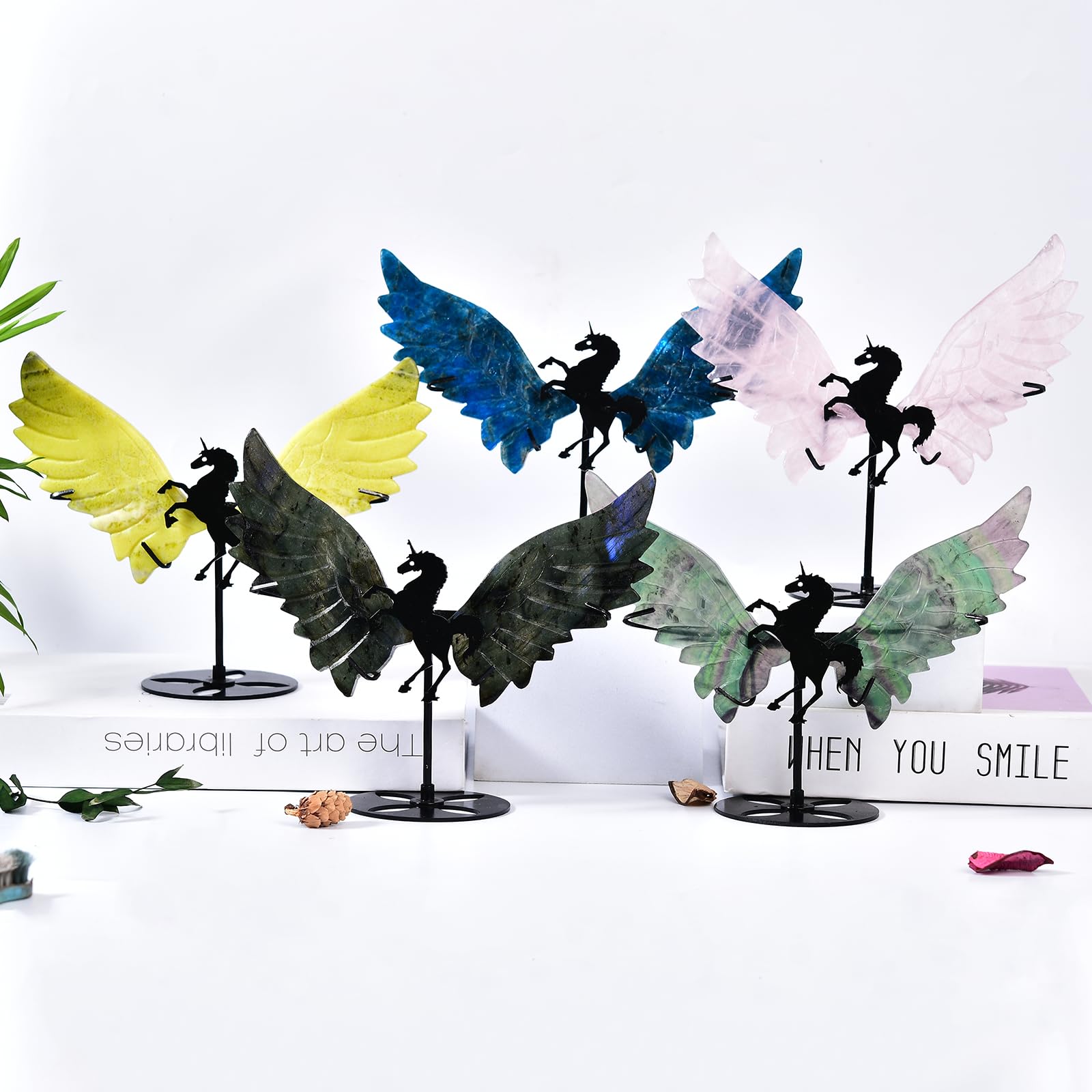 JIC Gem unicorn wings with stand enhance crystal collections on a desk.
