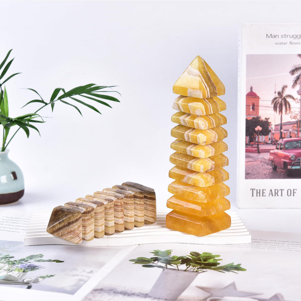 JIC Gem yellow fluorite tower reflects light with a soft yellow sheen.