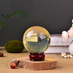 JIC Gem yellow quartz ball shows amber luster in sunlight