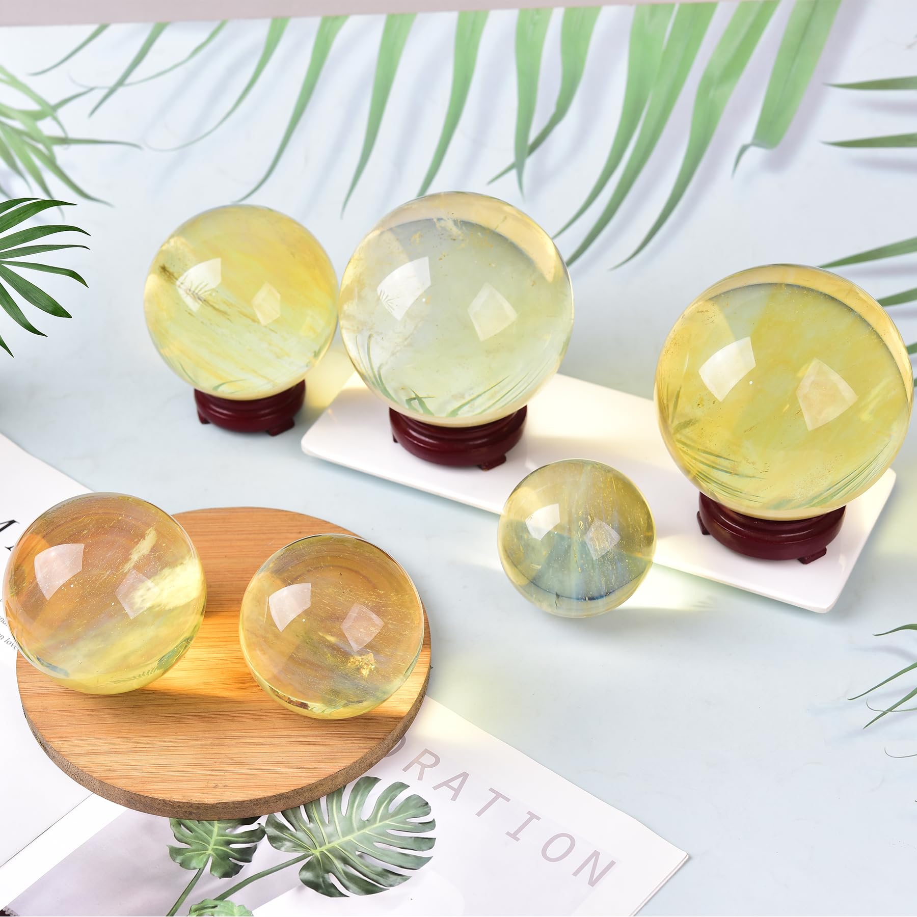 JIC Gem yellow quartz ball on wood stand complements study decor