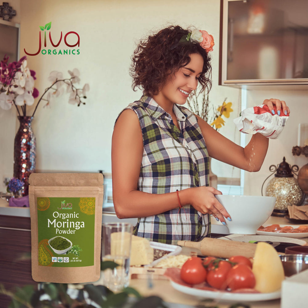 Jiva Organics Moringa powder in a tea cup with aroma.