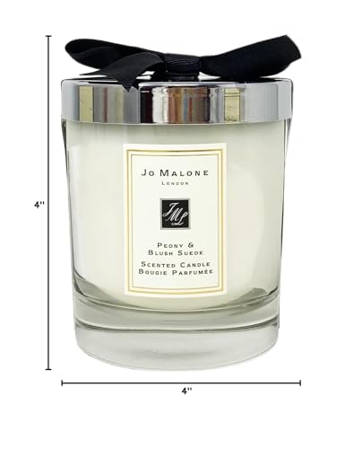 Jo Malone Peony & Blush Suede candle with lit wick for luxury evening scent and soft glow.