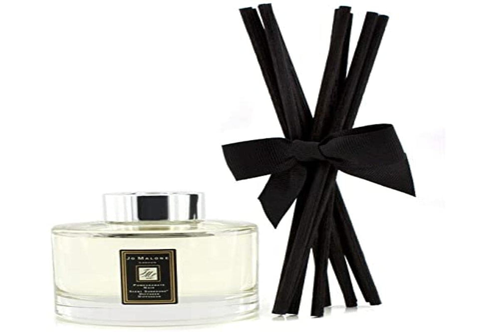 Jo Malone Pomegranate Noir diffuser bottle for a long-lasting fragrant ambience in any room.