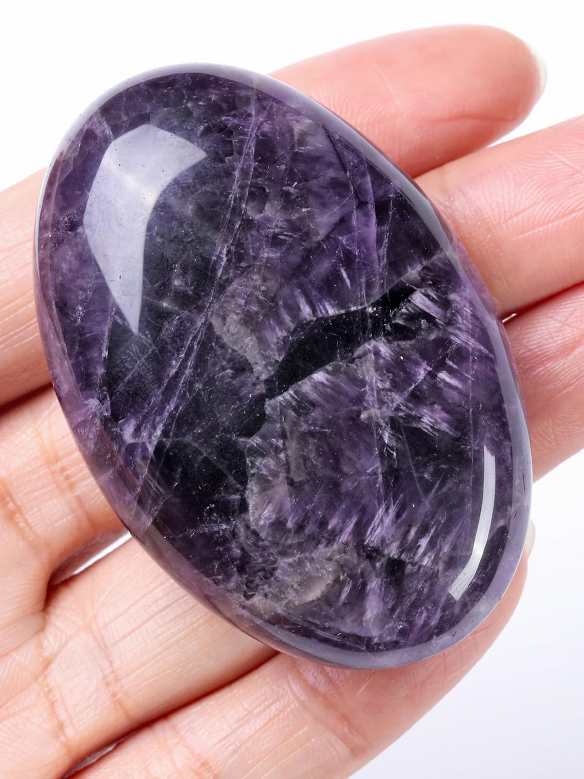 Jovivi amethyst worry stone palm close-up for anxiety relief and calm
