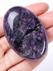 Jovivi amethyst worry stone palm close-up for anxiety relief and calm