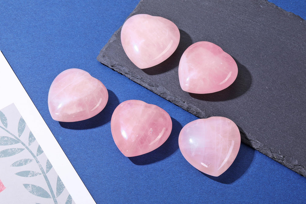 Jovivi meditation rose quartz heart — compact palm stone for centering.