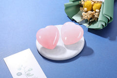 Jovivi rose quartz energy crystal — soothing palm stone for relaxation.