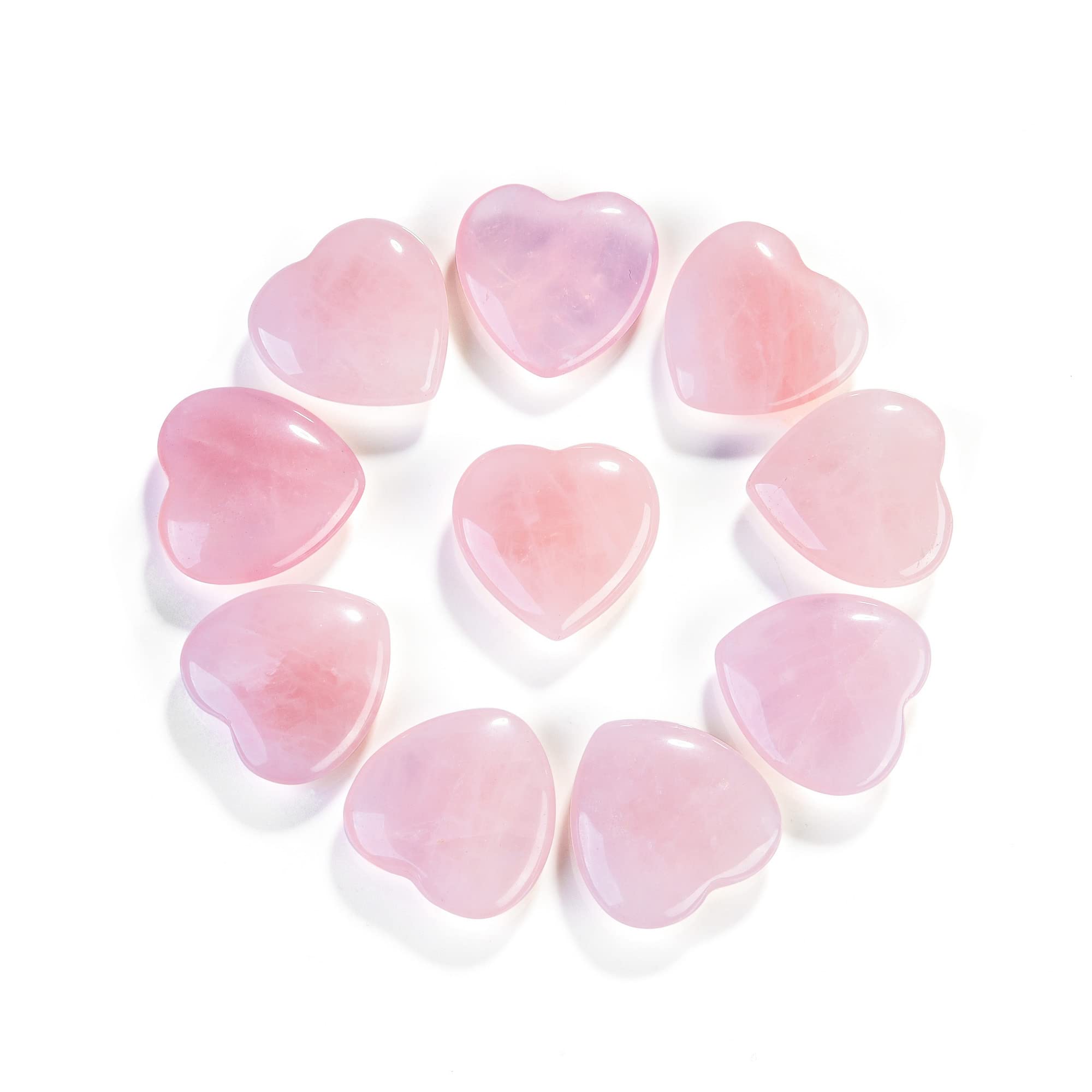 Close-up of Jovivi rose quartz heart crystal showing natural marbling.
