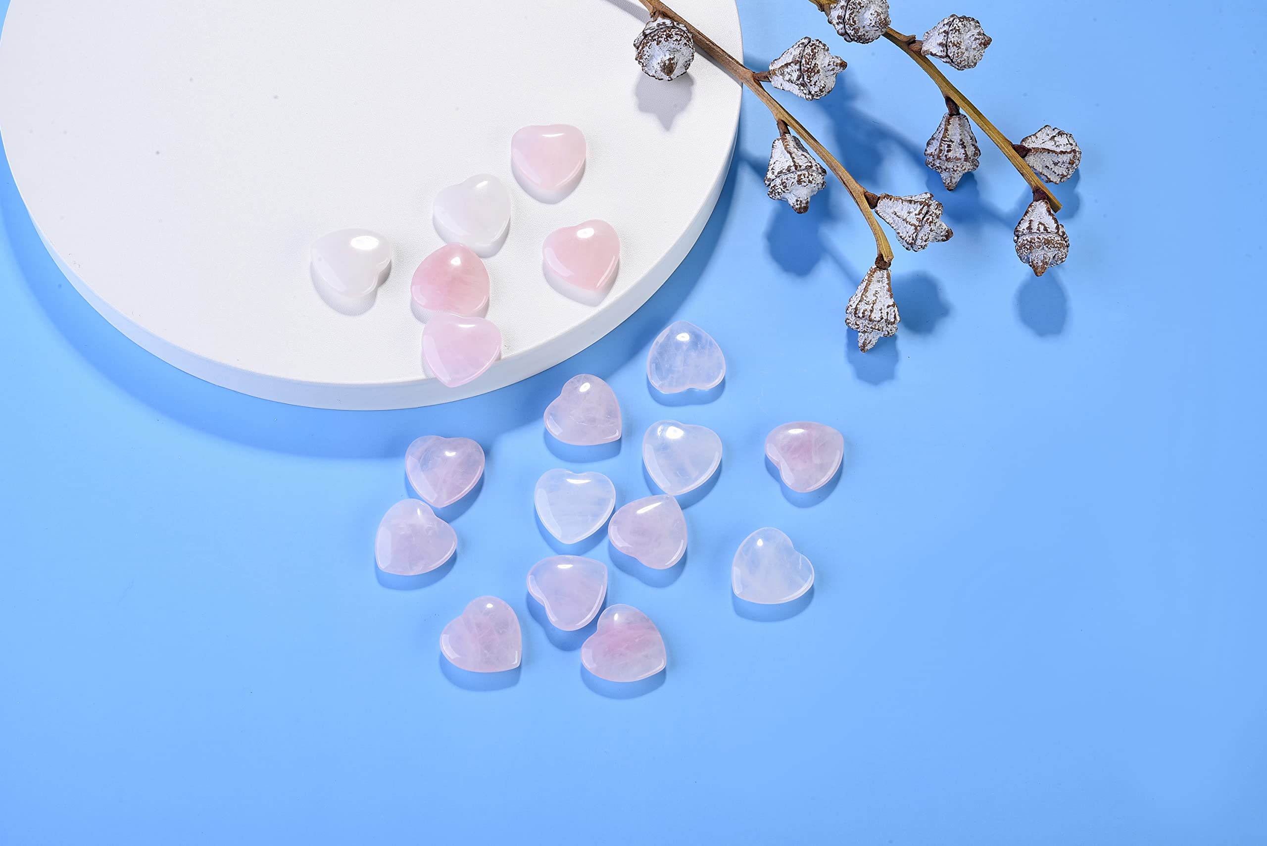 Jovivi rose quartz heart palm stone held during mindfulness practice.