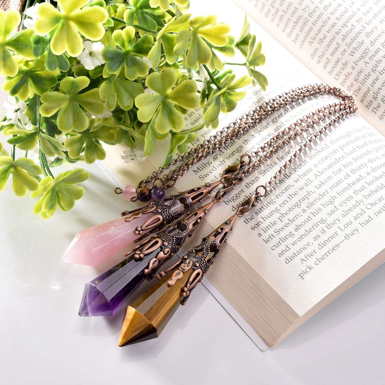 Jovivi rose quartz pendulum inviting calm energy during meditation