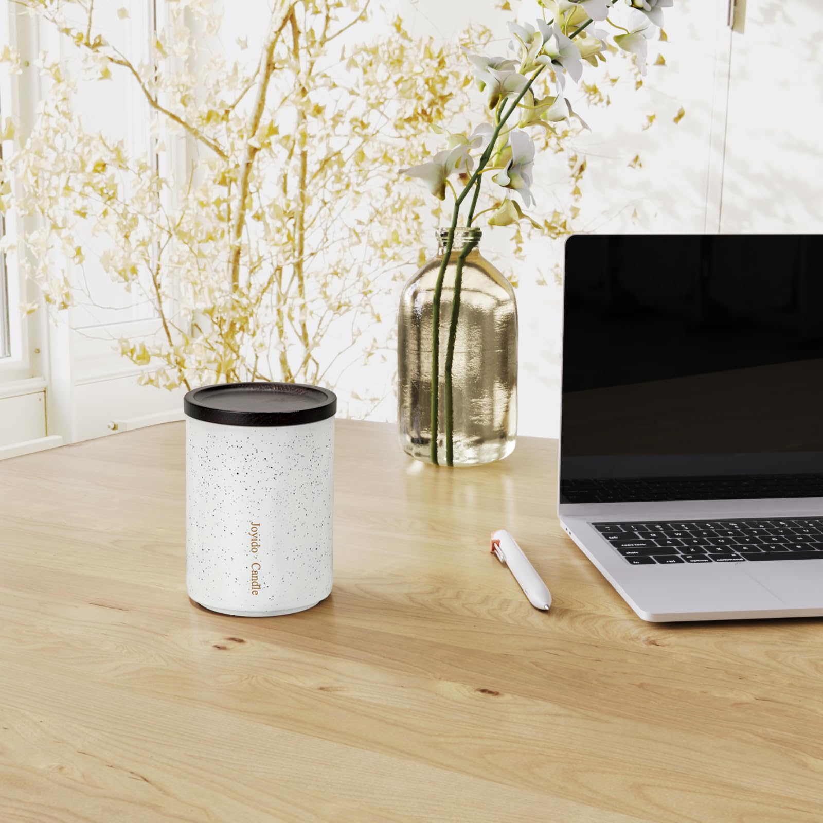 Joyido candle in a cozy bedroom setting; enhances relaxation and mood.