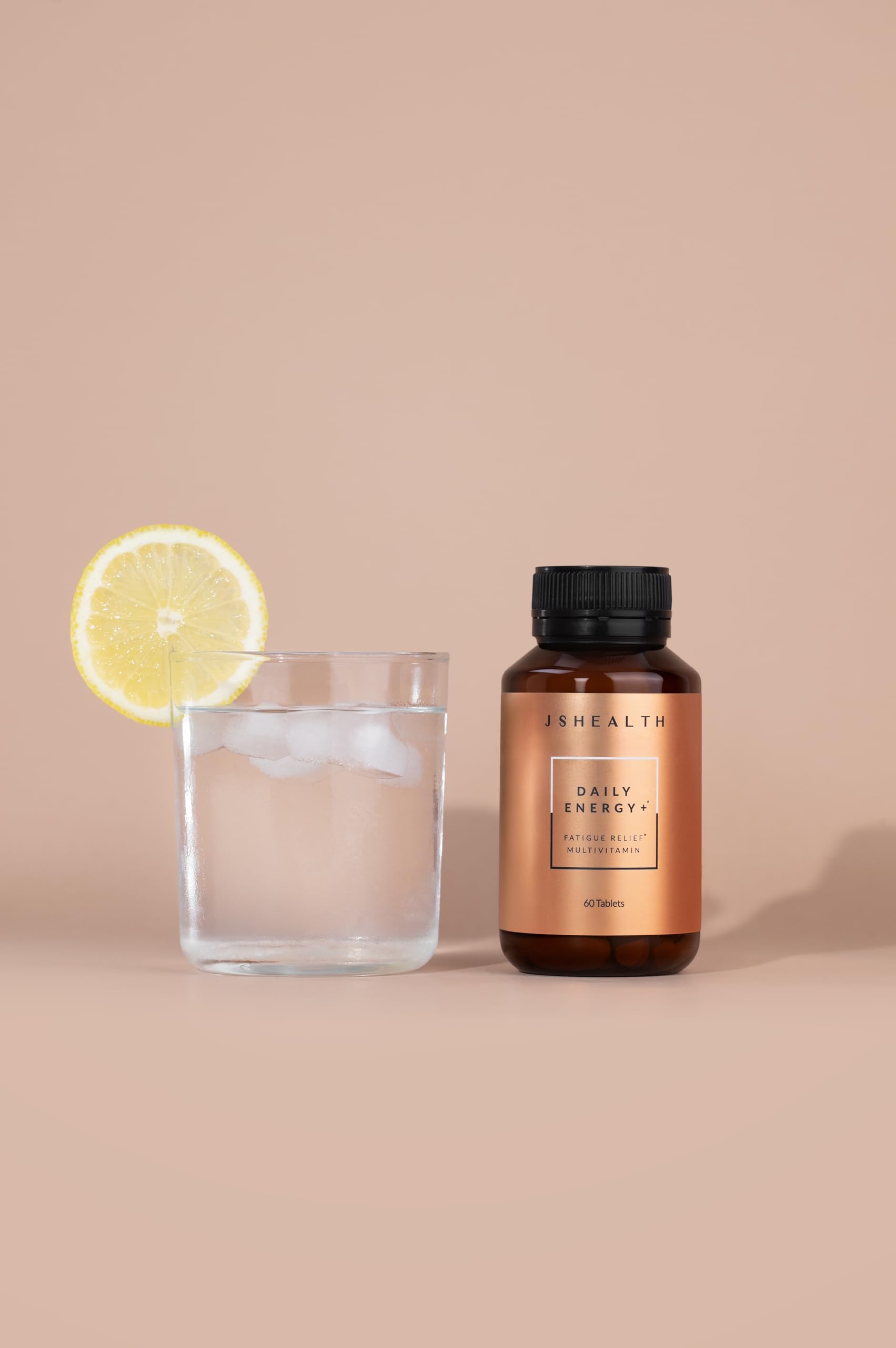 JSHealth Daily Energy packaging highlights vegan, non-GMO formula.