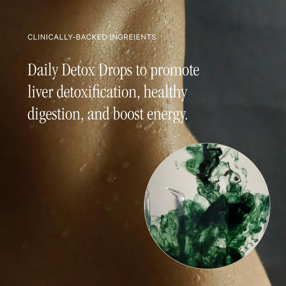 Juna Chlorophyll Drops poured into a glass showing bright green liquid