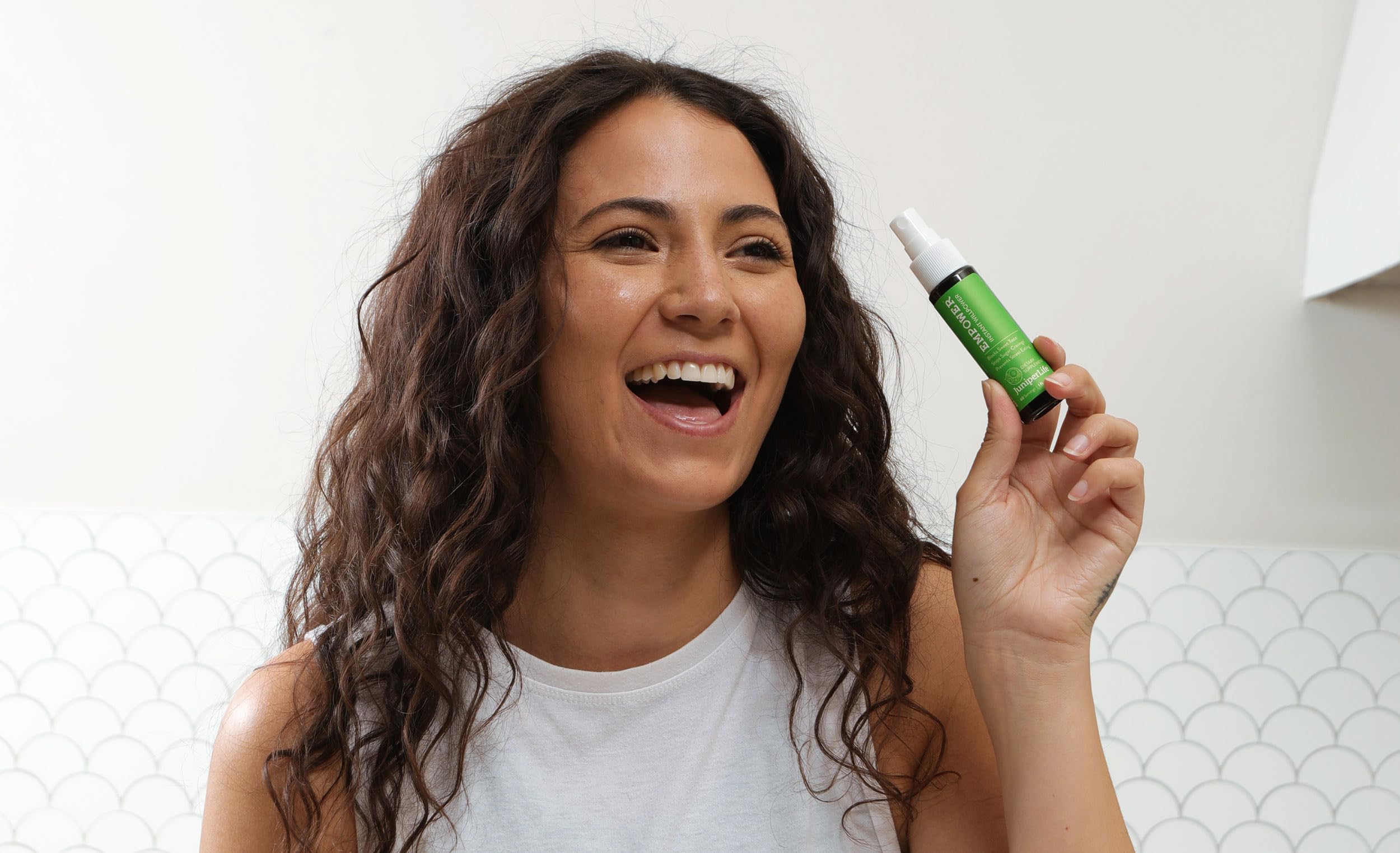 JuniperLIfe Empower travel-size spray ready for discreet use
