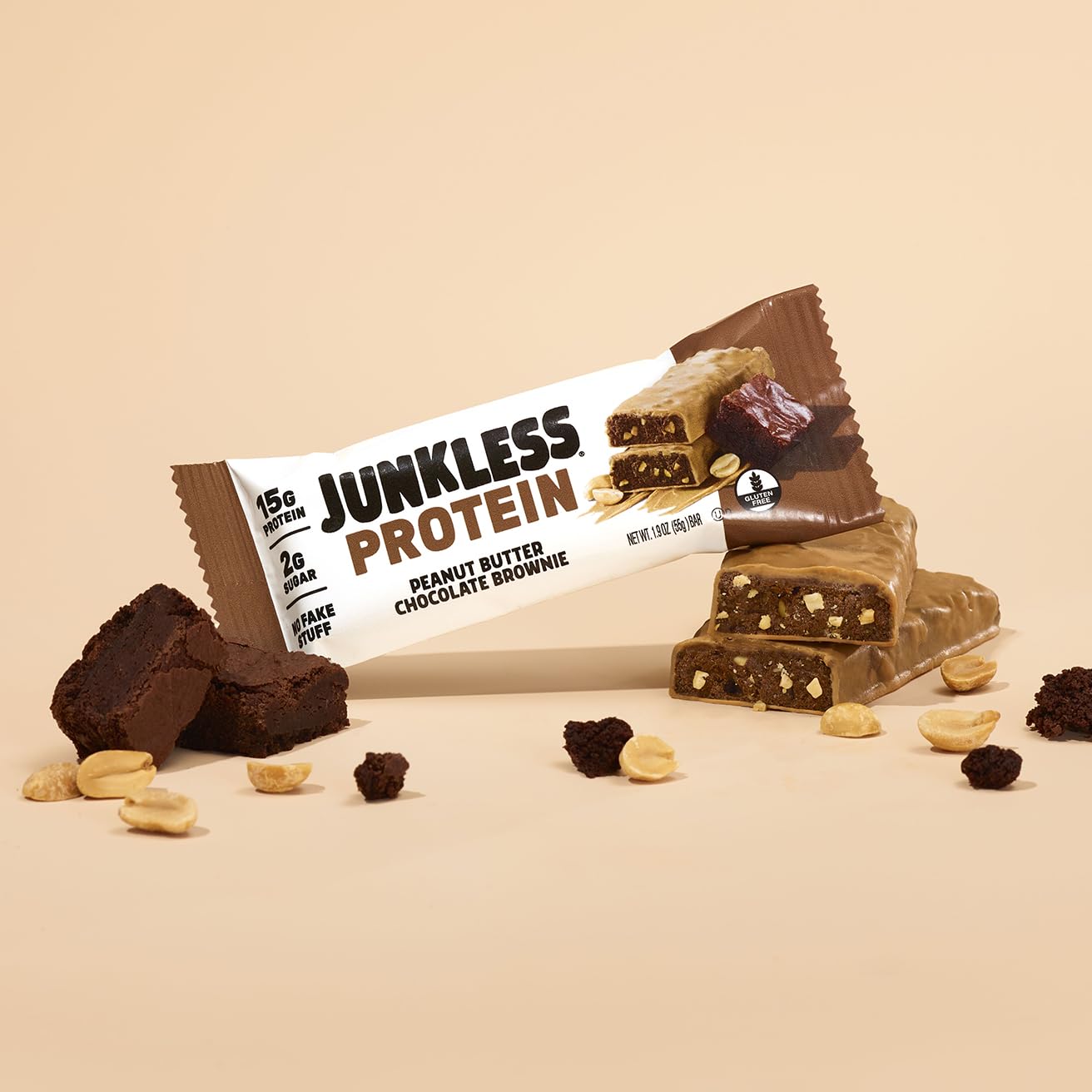 JUNKLESS Peanut Butter Chocolate Brownie bar in hand conveys portable satisfaction and fiber boost.
