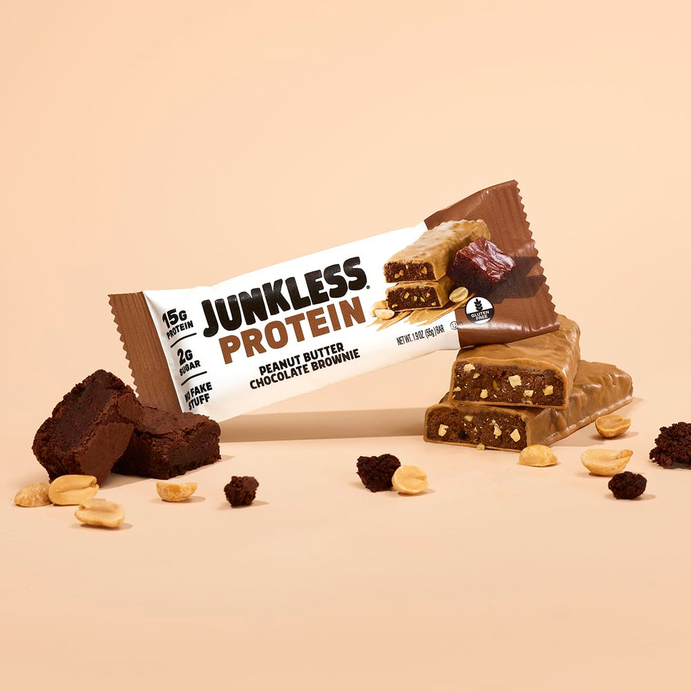 JUNKLESS Peanut Butter Chocolate Brownie bar in hand conveys portable satisfaction and fiber boost.