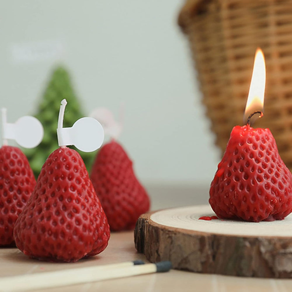 Juroicessry red strawberry candle as a decorative table accent