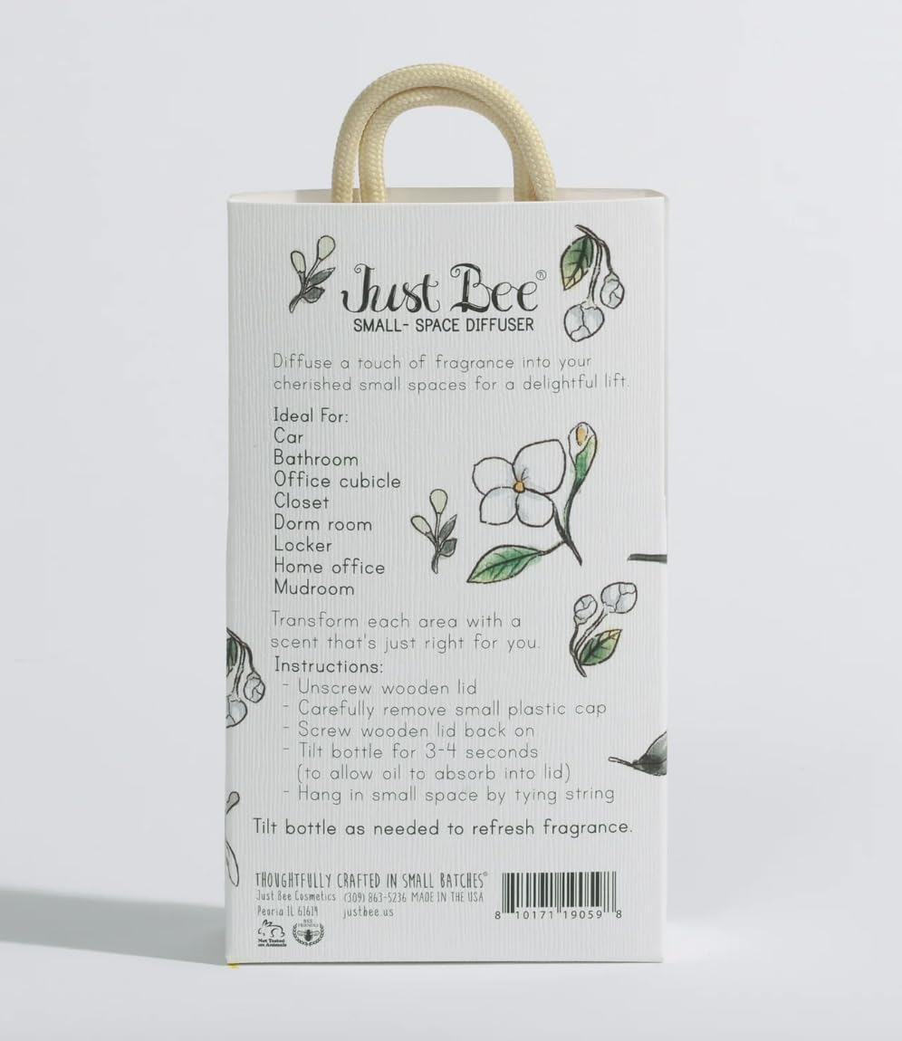 Just Bee diffuser hanging from a rearview mirror for portable aromatherapy in cars