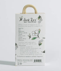 Just Bee diffuser hanging from a rearview mirror for portable aromatherapy in cars