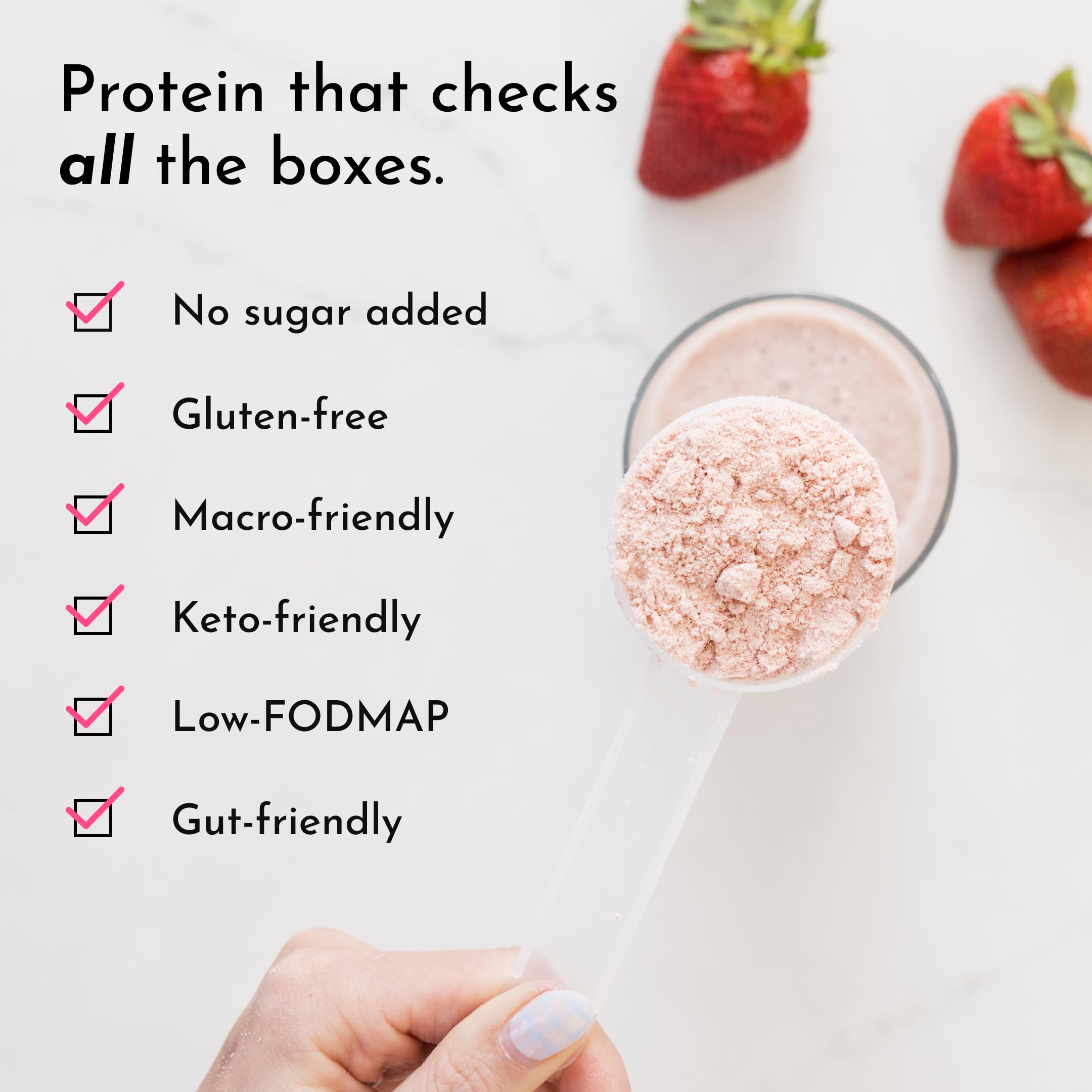 Just Ingredients Strawberries & Cream protein powder bottle beside a shake demonstrates versatile daily protein use.