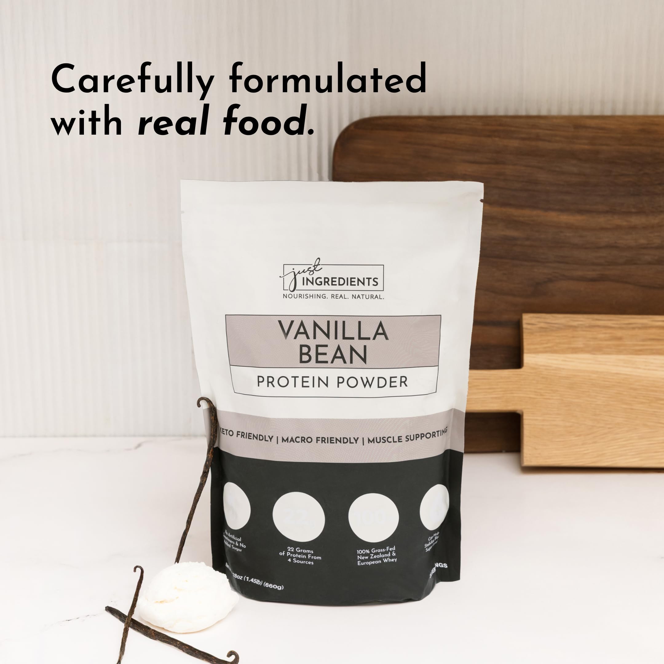 JUST INGREDIENTS Vanilla Bean Protein Powder on shelf suggests pantry-ready nutrition.