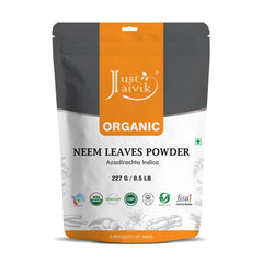 Just Jaivik neem powder bottle for natural hair and skin care.